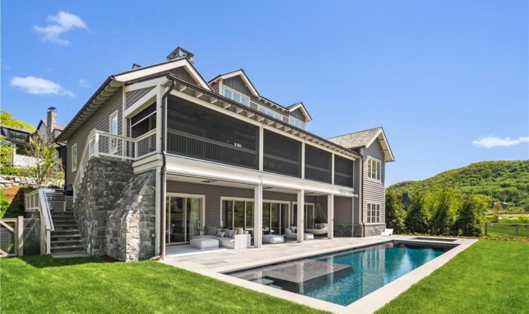 Rear view of house featuring a yard, a sunroom, an outdoor living space, and a patio area